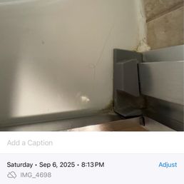 Hair in bathtub, timestamped 8:13, after room was supposedly recleaned.