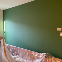 We snapped this pic during the painting. All of our furniture was covered and protected during the painting.