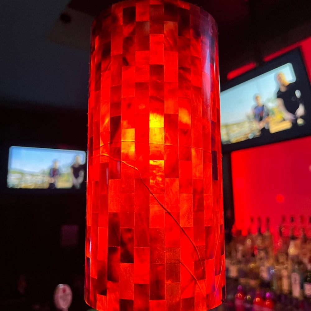a red lamp hanging from the ceiling a red lamp hanging from the ceiling