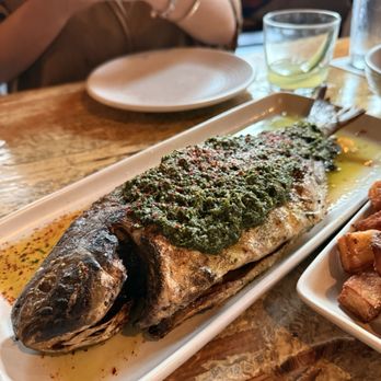 Peche Seafood and Grill - Whole Grilled Fish - Pompano with salsa verde - Seafood Near Me - New Orleans, Louisiana Peche Seafood and Grill - Whole Grilled Fish - Pompano with salsa verde - Seafood Near Me - New Orleans, Louisiana