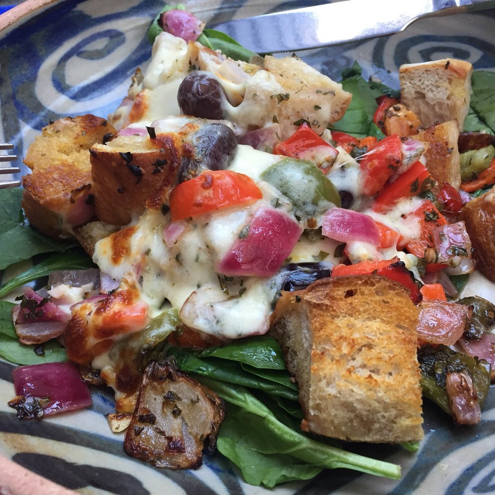 Winds Cafe - Salad (warm veggies and bread on a bed of fresh cold spinach). Interesting combination - American Near Me - Yellow Springs, Ohio Winds Cafe - Salad (warm veggies and bread on a bed of fresh cold spinach). Interesting combination - American Near Me - Yellow Springs, Ohio