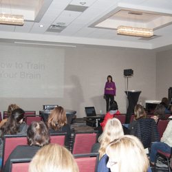 Life Coach Laura White - Speaking at a conference on Mindset