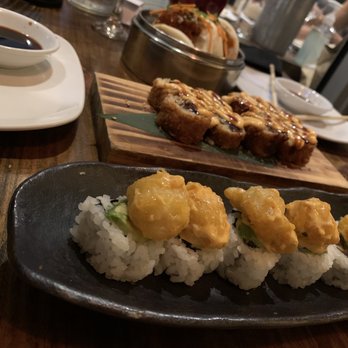Pubbelly Sushi Brickell - From front to back: - Rockshrimp Tempura Roll - Crispy Salmon Roll - Buffalo Chicken Bao Buns - Sushi Bars Near Me - Miami, Florida Pubbelly Sushi Brickell - From front to back: - Rockshrimp Tempura Roll - Crispy Salmon Roll - Buffalo Chicken Bao Buns - Sushi Bars Near Me - Miami, Florida