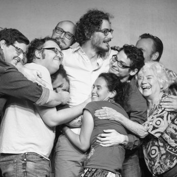 The Upfront Theatre - a group of people hugging each other - Performing Arts Near Me - Bellingham, Washington