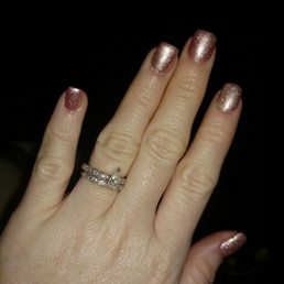 Acrylic nails with pink gel polish and silver glitter dust Acrylic nails with pink gel polish and silver glitter dust