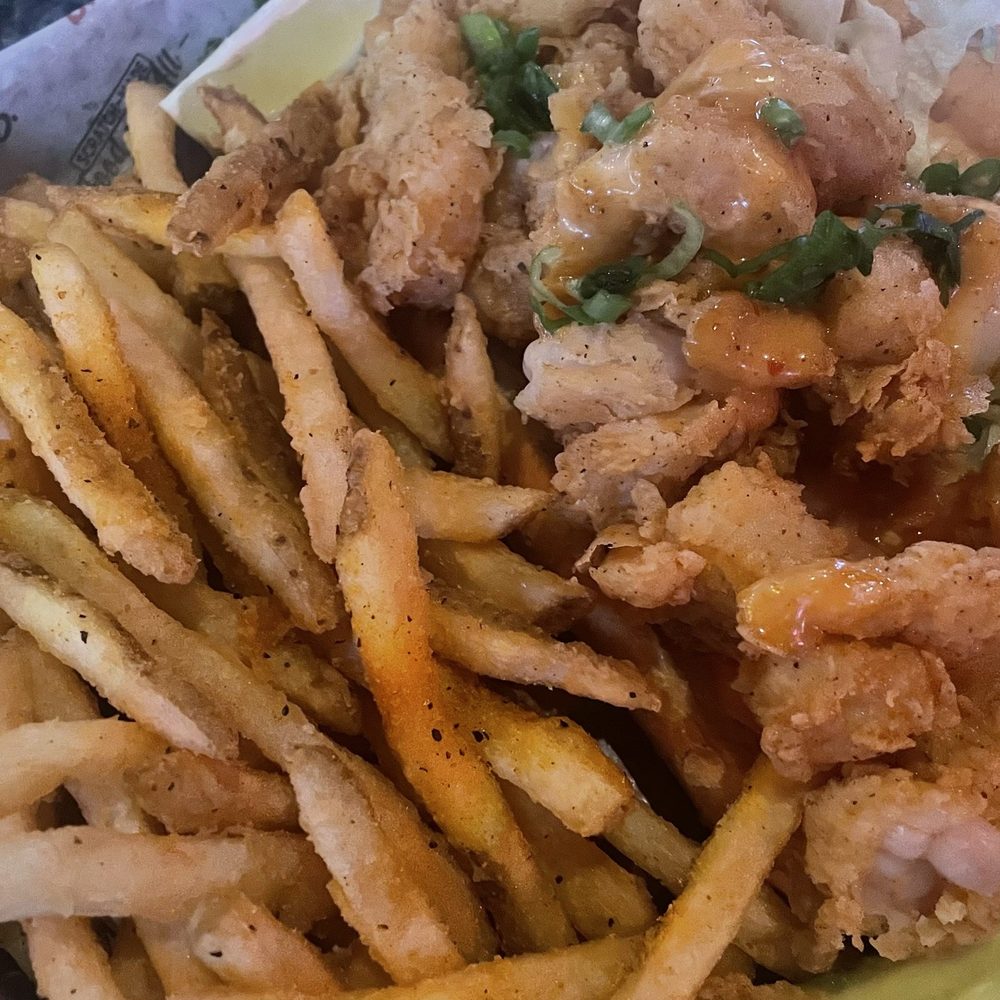 Shrimp poorboy with seasoned fries. Very tasty. Shrimp poorboy with seasoned fries. Very tasty.
