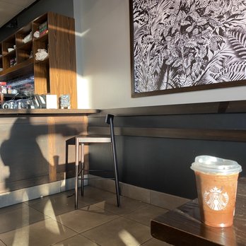 Starbucks - a coffee cup on a table in a coffee shop - Coffee & Tea Near Me - Collegeville, Pennsylvania Starbucks - a coffee cup on a table in a coffee shop - Coffee & Tea Near Me - Collegeville, Pennsylvania