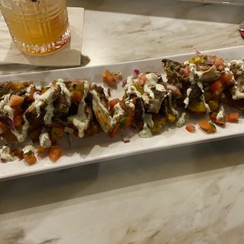 Zeke's Kitchen & Bar - Plantain Nachos - New American Near Me - Smyrna, Georgia Zeke's Kitchen & Bar - Plantain Nachos - New American Near Me - Smyrna, Georgia