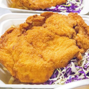 Wholly Schnit - Delicious handmade chicken schnitzel on a bed of fries and coleslaw - Food Trucks Near Me Wholly Schnit - Delicious handmade chicken schnitzel on a bed of fries and coleslaw - Food Trucks Near Me
