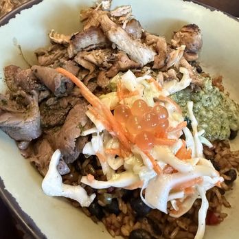 Satu'li Canteen - Chimichurri beef and chopped wood Chopped Wood-Grilled Chicken Bowl with a rice and beans base in charred, green onion vinaigrette - New American Near Me - Lake Buena Vista, Florida