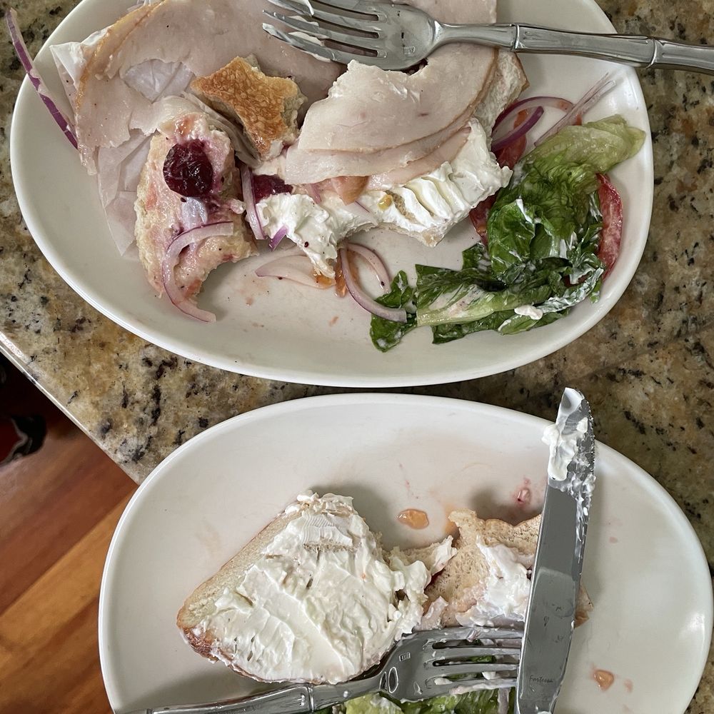 Turkey, cream cheese, lettuce, tomato, onions, and some sort of cranberry sauce.
