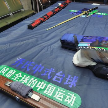 Ox Billiards - skis and ski poles laid out on a bed - Pool Halls Near Me - Seattle, Washington Ox Billiards - skis and ski poles laid out on a bed - Pool Halls Near Me - Seattle, Washington