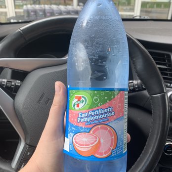 7-Eleven - a hand holding a bottle of water - Coffee & Tea Near Me - St Albert, Alberta 7-Eleven - a hand holding a bottle of water - Coffee & Tea Near Me - St Albert, Alberta