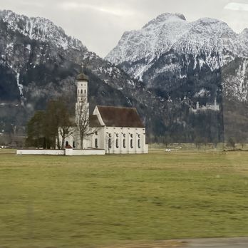 Schloss Neuschwanstein - Castle behind the church on the way there - Landmarks & Historical Buildings Near Me - Schwangau, BY