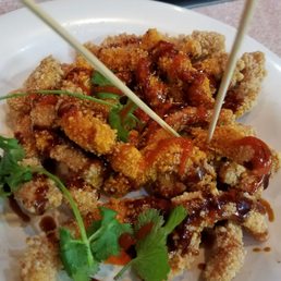 Hoisen sauce, saracha hot sauce, topped with hot oil and sprigs of cilantro- Calamari Hoisen sauce, saracha hot sauce, topped with hot oil and sprigs of cilantro- Calamari