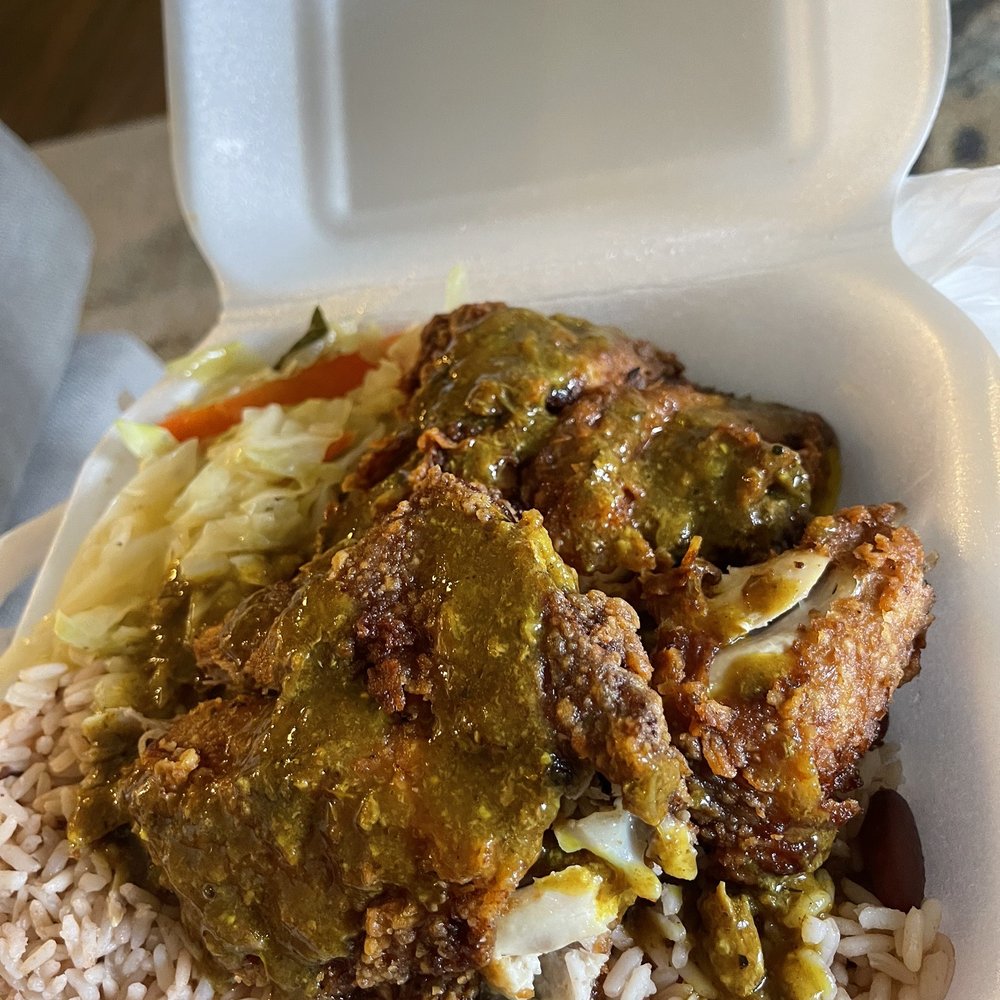 Negril - Fries chicken with rice and peas and curry gravy - Caribbean Near Me - Orlando, Florida Negril - Fries chicken with rice and peas and curry gravy - Caribbean Near Me - Orlando, Florida