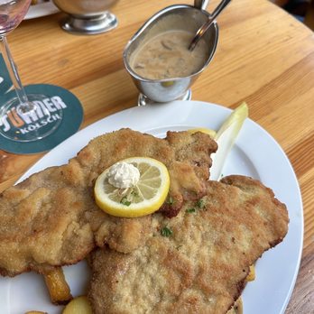 Bei Oma Kleinmann - This is the traditional schnitzel done with calf not pig. It was amazing! - Gastropubs Near Me - Cologne, NW Bei Oma Kleinmann - This is the traditional schnitzel done with calf not pig. It was amazing! - Gastropubs Near Me - Cologne, NW