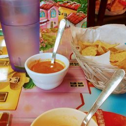 a bowl of soup and a bowl of tortillas