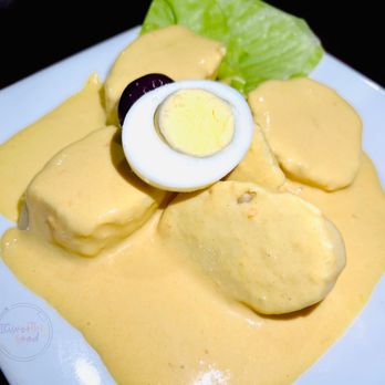 Machu Picchu Peruvian Restaurant - Papa a la huancaina. Its slices of cooked potatoes covered in yellow mild sauce. It's like a potato salad with a lot of sauce. - Peruvian Near Me - Bethlehem, Pennsylvania Machu Picchu Peruvian Restaurant - Papa a la huancaina. Its slices of cooked potatoes covered in yellow mild sauce. It's like a potato salad with a lot of sauce. - Peruvian Near Me - Bethlehem, Pennsylvania