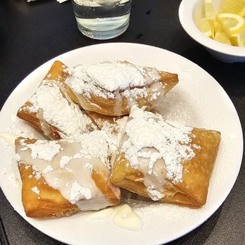 Grits and Eggs Breakfast Kitchen - Beignets with Powdered Sugar - Breakfast & Brunch Near Me - Atlanta, Georgia Grits and Eggs Breakfast Kitchen - Beignets with Powdered Sugar - Breakfast & Brunch Near Me - Atlanta, Georgia
