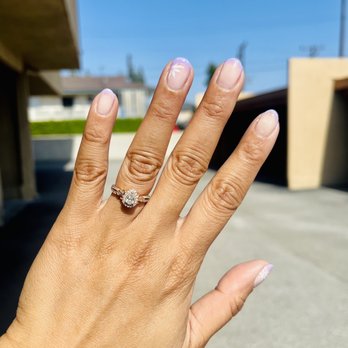 Utopia Beauty Salon - lavender gel french tip with added white flowers - Nail Salons Near Me - Arcadia, California