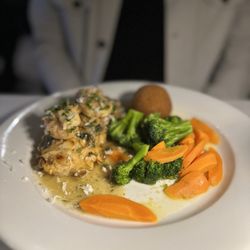 Nona’s Italian Grill - Special: Salmon Almondine with grilled shrimp, vegetables, potato croquette