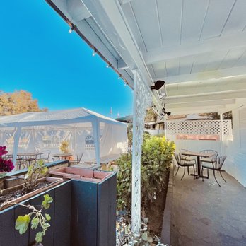 Parioli Italian Bistro - a patio with a table and chairs - Italian Near Me - Solana Beach, California