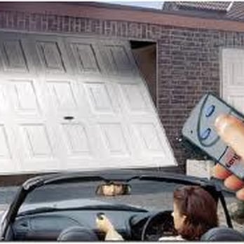 Garage Door Repair - a hand holding a remote control - General Contractors Near Me - Plano, Texas Garage Door Repair - a hand holding a remote control - General Contractors Near Me - Plano, Texas