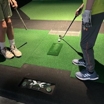 X-Golf Reno - This was so awesome! The ball comes up, rolls to the tee and pops up. You don't have to bend over to get your ball... genius! - Golf Near Me - Reno, Nevada