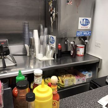 Harlo Grill - a counter with condiments and condiments - Diners Near Me - Melrose Park, Illinois Harlo Grill - a counter with condiments and condiments - Diners Near Me - Melrose Park, Illinois