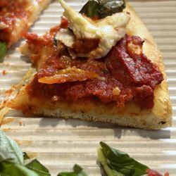 Paisano's Pizzeria - Slathered tomato paste