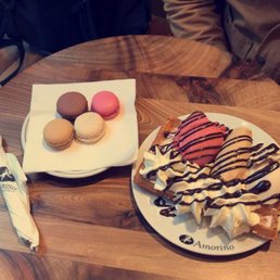 macaroons and waffle topped with gelato, whipped cream, and chocolate