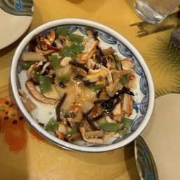 a bowl of food on a table a bowl of food on a table