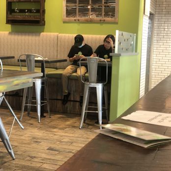 Green Tomato Grill - Employee eating inside. - New American Near Me - Brea, California