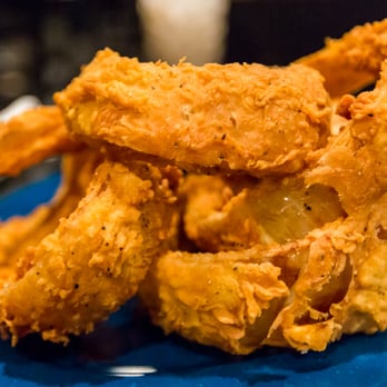 Mojo Old City BBQ - Delicious breaded onion rings with a slightly spicy kick. - Barbeque Near Me - St. Augustine, Florida