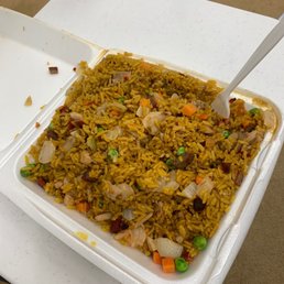 a container of rice and vegetables a container of rice and vegetables