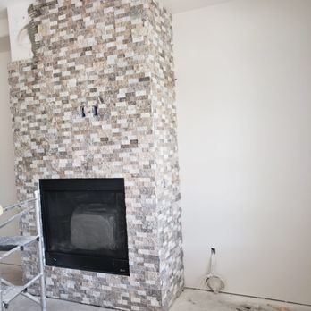Pro Tile and Remodeling - a brick fireplace - Tiling Near Me Pro Tile and Remodeling - a brick fireplace - Tiling Near Me