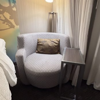 Courtyard by Marriott Cleveland Airport North - A chair that isn't comfortable next to the Little table that has somebody's drinks filled all over it - Hotels Near Me - North Olmsted, Ohio Courtyard by Marriott Cleveland Airport North - A chair that isn't comfortable next to the Little table that has somebody's drinks filled all over it - Hotels Near Me - North Olmsted, Ohio