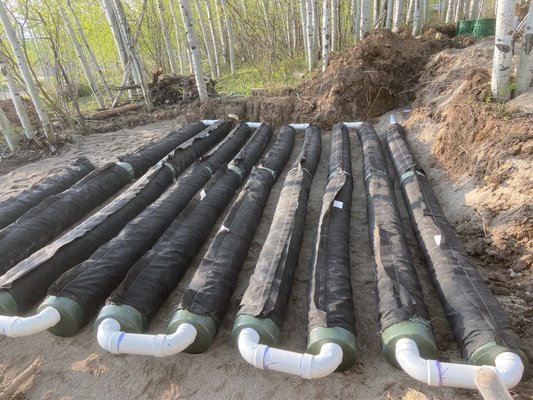 Septic System Install - Recent septic system install. Removed trees, built road, added septic system, water and sewer lines, and added parking pad. Septic System Install - Recent septic system install. Removed trees, built road, added septic system, water and sewer lines, and added parking pad.