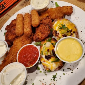 Briny Irish Pub - Sampler app. Mozzarella sticks, potato skins, fish sticks, chicken tenders. - American Near Me - Pompano Beach, Florida Briny Irish Pub - Sampler app. Mozzarella sticks, potato skins, fish sticks, chicken tenders. - American Near Me - Pompano Beach, Florida