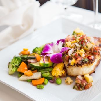 Cafe Marquesa - a plate of food and a glass of wine - New American Near Me - Key West, Florida