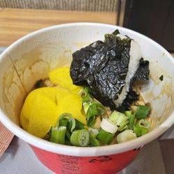 Asia Market - Bulgogi Alfredo Tangle package noodles with added kimbap, pickled radish, and green onion from the self-serve noodles station