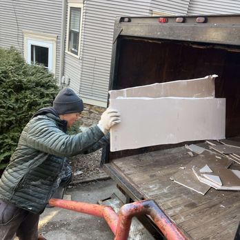 Junk Jumpers - Trevor throwing dry wall into the Junk Jumpers box truck. - Junk Removal & Hauling Near Me Junk Jumpers - Trevor throwing dry wall into the Junk Jumpers box truck. - Junk Removal & Hauling Near Me