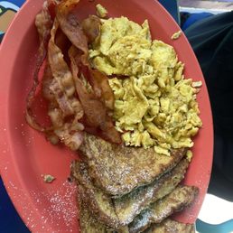 French toast, eggs scrambled hard and extra crispy bacon.