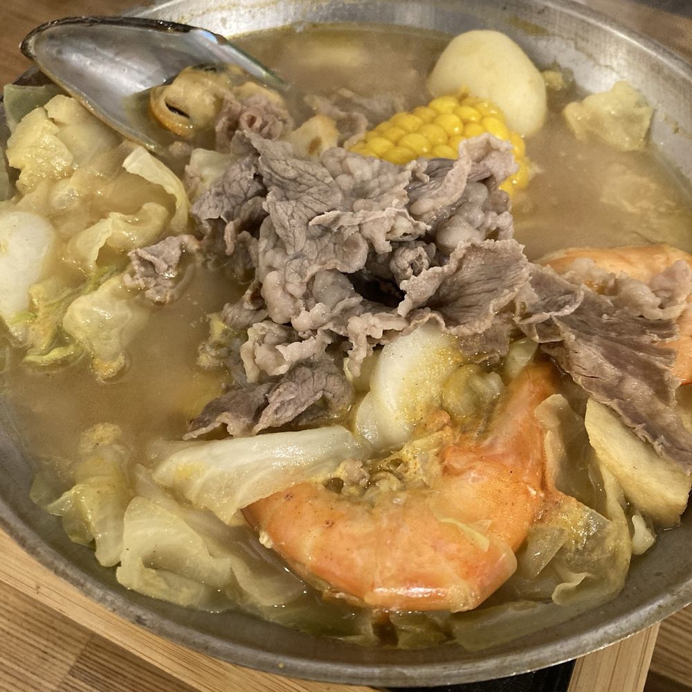 Curry soup with tofu, beef, veggies and seafood Curry soup with tofu, beef, veggies and seafood