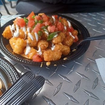 Mad Beach Craft Brewing - Totchos added green onions and tomatoes they were ok but there more for if u drink alot and need something to soak up the alcohol - Breweries Near Me - Madeira Beach, Florida Mad Beach Craft Brewing - Totchos added green onions and tomatoes they were ok but there more for if u drink alot and need something to soak up the alcohol - Breweries Near Me - Madeira Beach, Florida