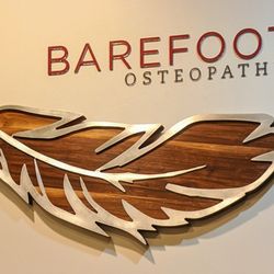 Barefoot Osteopathy - Logo on wall.