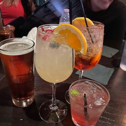 The Neighborhood Tavern - Drinks left to right: Tap beer White sangria Sprizatta Pomegranate mule