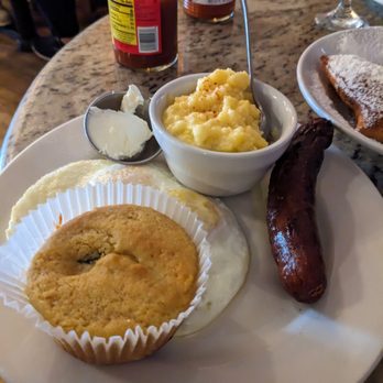 Rabalais' Bistro - Cajun sunrise breakfast w/ two eggs , grits , jalapeno bread, andoille sausage. - Bakeries Near Me - Santa Paula, California Rabalais' Bistro - Cajun sunrise breakfast w/ two eggs , grits , jalapeno bread, andoille sausage. - Bakeries Near Me - Santa Paula, California