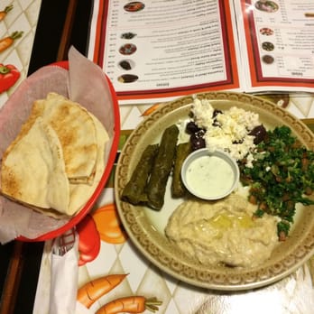 Goodies Mediterranean - a plate of pita bread and a plate of hummus - Mediterranean Near Me - Syracuse, New York Goodies Mediterranean - a plate of pita bread and a plate of hummus - Mediterranean Near Me - Syracuse, New York